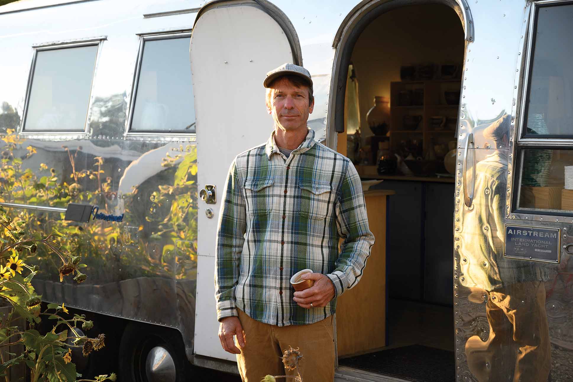 a person standing in front of an open door of a trailer