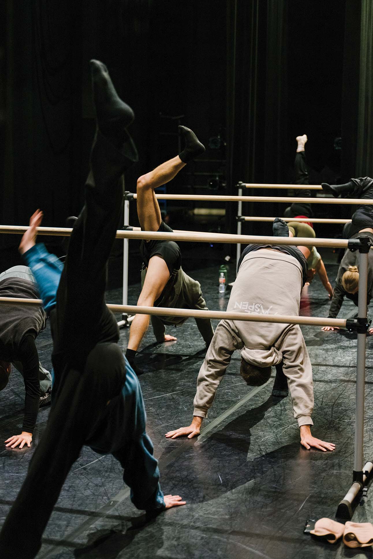 a group of people doing handstands on a stage