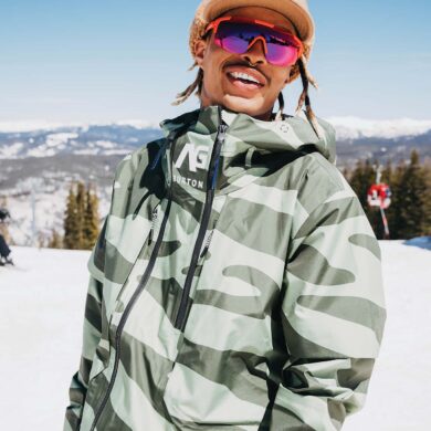 a person wearing a hat and sunglasses