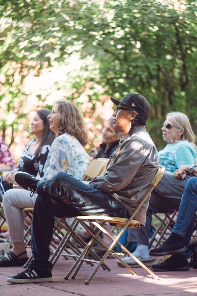 a group of people sitting in chairs