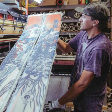 a person holding a snowboard