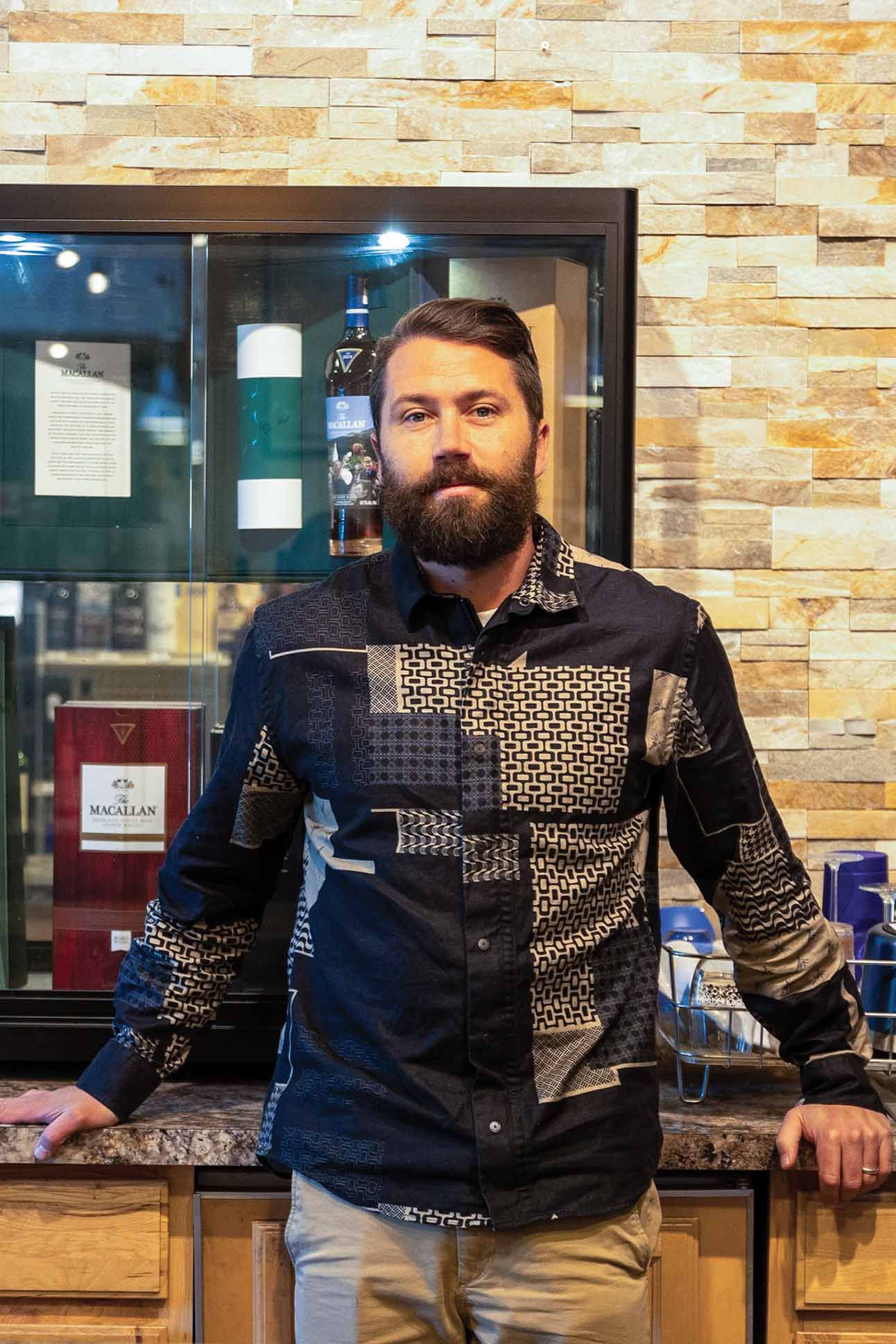 a person standing in front of a glass case