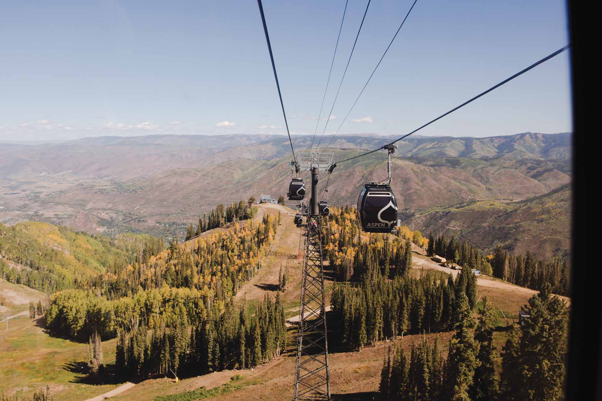 a cable car going over a mountain