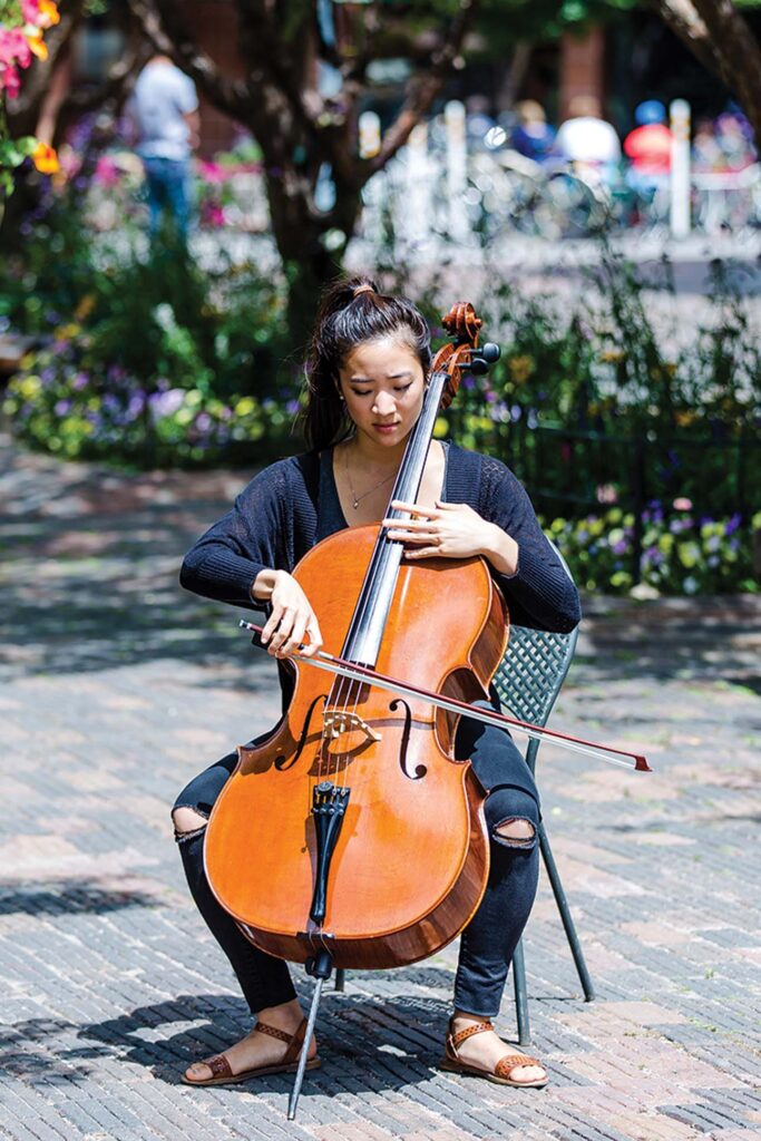 a person playing a cello