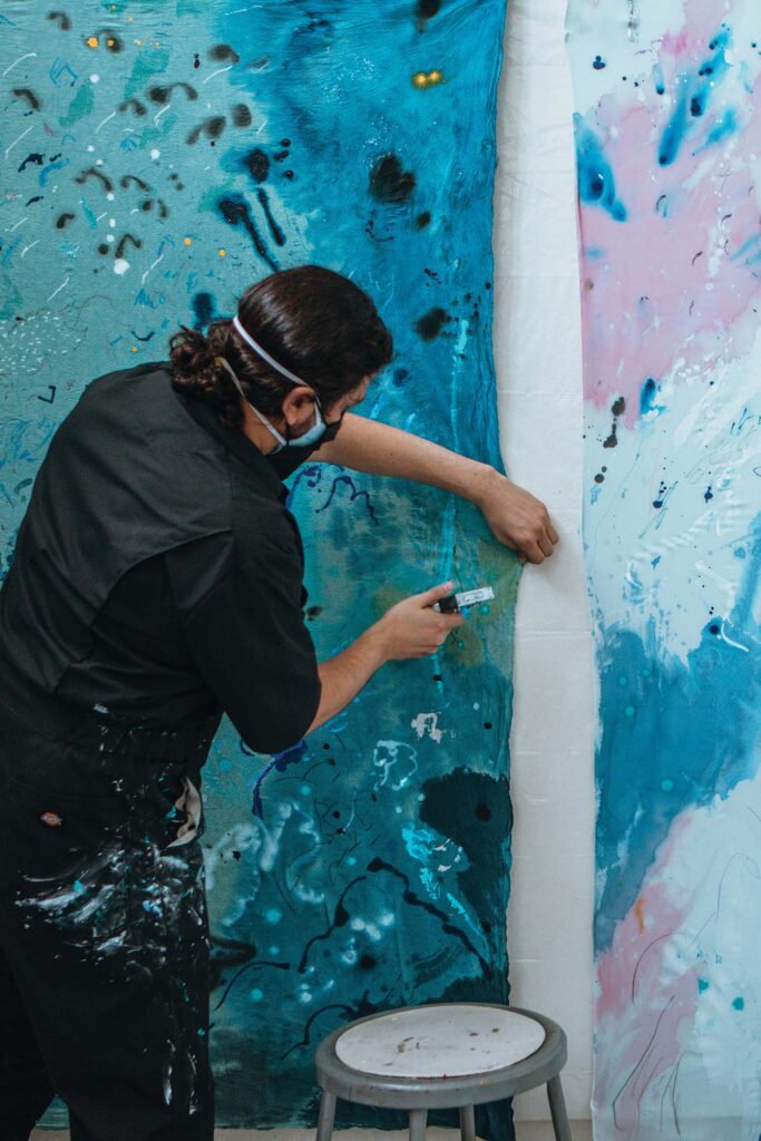 a person painting a wall