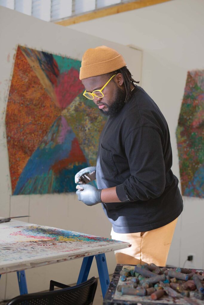 a person wearing yellow glasses and gloves